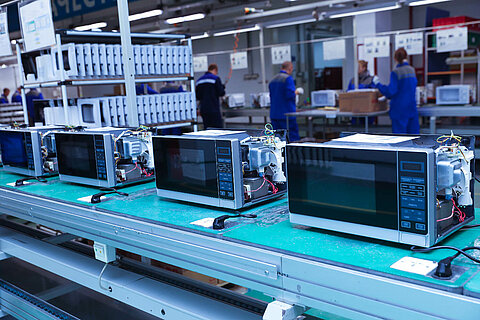 Conveyor belt of a production line for microwave ovens.